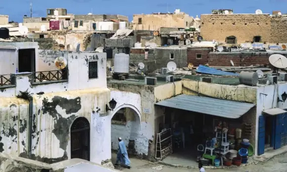  ?? LORENZO TUGNOLI ?? In Libya’s capital, parliament and other buildings have become concrete carcasses, while clashes often erupt suddenly, trapping residents in their homes and creating no-go zones.