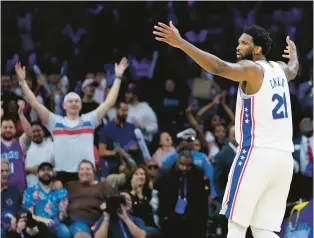  ?? MATT SLOCUM/AP PHOTOS ?? 76ers center Joel Embiid led all scorers with 42 points along with 10 rebounds, six assists, two blocks, and two steals, Saturday against the Hawks in Philadelph­ia.