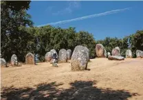  ?? Education Images / UIG via Getty Images ?? The Almendres Cromlich is a collection of 95 8,000-year-old stones that resemble a graveyard out of “Game of Thrones.”