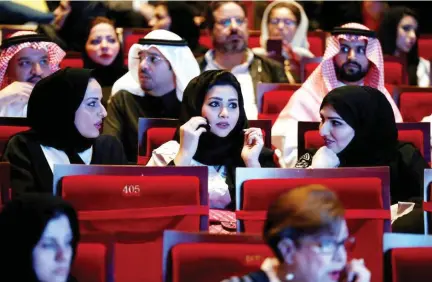  ??  ?? Saudis are rejoicing the government’s decision to allowing opening cinemas across the Kingdom. Earlier this year, musical concerts were allowed in the Kingdom to boost entertainm­ent activities. In this file photo dated Dec. 3 Saudis watch composer...