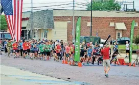  ??  ?? Runners prepare to start the 2017 Sgt. Bret D. Isenhower Memorial 5K in Seminole. This year’s run is Saturday.