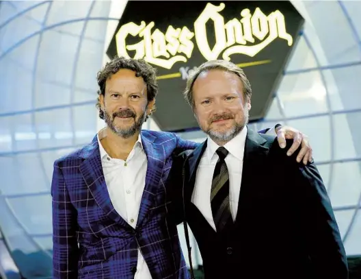  ?? JOHN WILSON NETFLIX ?? Producer Ram Bergman (left) and writer-director Rian Johnson attend the premiere of “Glass Onion: A Knives Out Mystery” in 2022.