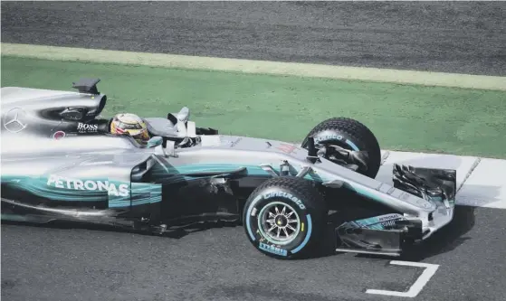  ??  ?? 2 Lewis Hamilton takes the new Mercedes for a spin at Silverston­e. His team-mate for the 2017 season will be Finnish driver Valtteri Bottas.