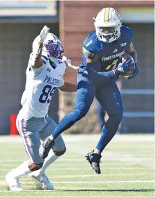  ?? STAFF PHOTO BY ROBIN RUDD ?? UTC’s Brandon Dowdell intercepts a pass in front of Furman’s Thomas Gordan in a SoCon game on Nov. 2, 2019, at Finley Stadium.