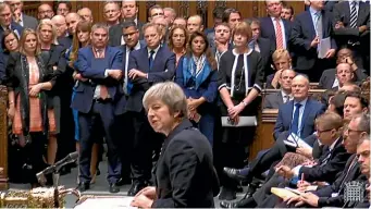  ?? AP ?? Prime Minister Theresa May makes a statement in the House of Commons, in London, postponing Parliament’s vote on her European Union divorce deal.