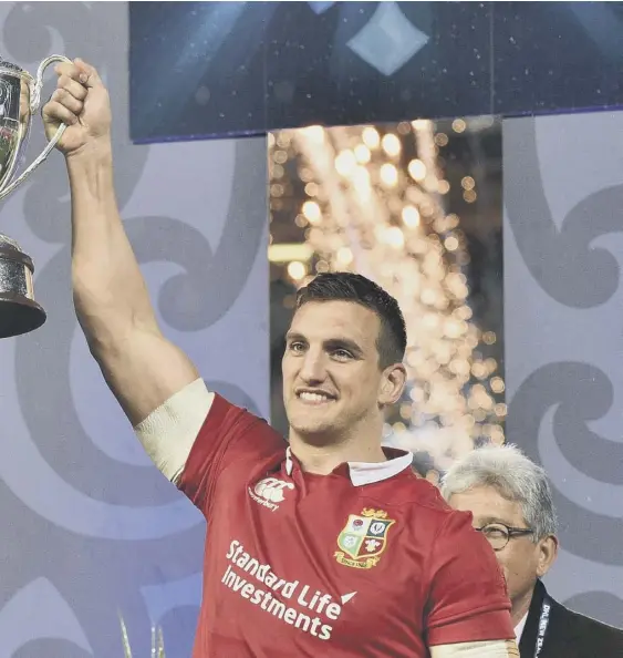  ??  ?? 2 British and Irish Lions skipper Sam Warburton, right, and New Zealand captain Kieran Read hold up the trophy after the drawn 2017 series following the third Test at Eden Park in Auckland. The Lions will now travel to South Africa next summer for an eight-fixture tour which is scheduled to kick off against Stormers at the new Cape Town Stadium on 3 July.