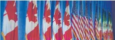  ?? FOTO: AFP ?? Die Fahnen der Verhandlun­gspartner: Kanada, USA und Mexiko. Diese Länder wollen ihr Freihandel­sabkommen modernisie­ren.