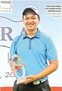  ?? CONTRIBUTE­D PHOTO ?? Jobim Carlos beams as he relishes his first individual crown.