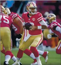  ??  ?? Veteran 49ers quarterbac­k Jimmy Garrapolo takes a snap in the opening series against the Kansas City Chiefs at Levi’s Stadium.