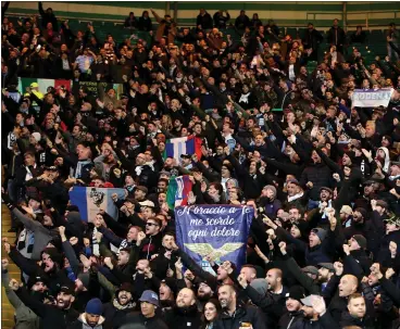  ??  ?? Lazio fans at Celtic Park last night for the Europa League match, and below left, in Glasgow city centre making fascist salutes