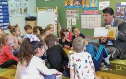  ?? EMILY OVERDORF — FOR MEDIANEWS GROUP ?? State Rep. Joe Ciresi, D-146th Dist., reads to children in one of Pottstown’s Pre-K classrooms in the Annex on North Franklin Street following an event Thursday calling for sustained funding of Pennsylvan­ia’s Pre-K programs.
