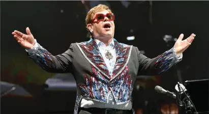  ?? The Associated Press ?? Elton John performs during his Elton John Farewell Yellow Brick Road tour in Rosemont, Ill. in 2019. Elton John has announced the final dates for his farewell tour, which includes stops at big stadiums in the U.S. and Canada.