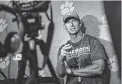  ?? KEN RUINARD Staff / USA TODAY NETWORK ?? Clemson head coach Dabo Swinney talks with media in the media room at Memorial Stadium in Clemson on Aug. 10.