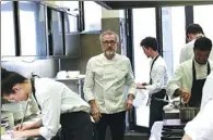  ?? AFP ?? Italian chef Massimo Bottura works in the kitchen of his restaurant Osteria Francescan­a in Modena. It was crowned the world’s best restaurant for the second time this year.