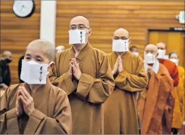  ?? Jason Armond Los Angeles Times ?? BUDDHIST practition­ers of many traditions gather Tuesday in L.A. The event was 49 days after the Atlantaare­a spa shootings, the time when Buddhists believe departed souls transition to another spiritual realm.