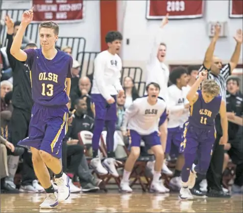  ?? Steph Chambers/Post-Gazette ?? Our Lady of the Sacred Heart’s Daren DiMichele (13) reacts after a 3-pointer during the PIAA semifinal game against Sewickley Academy. Thirty-five years after his father won a state title, DiMichele will play for one.