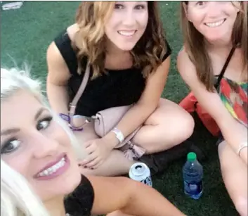  ??  ?? Photo/GreGory Bul In this 2017 handout image provided by Chelsea Romo, Romo (left) sits with Kelsi Kessler (above left) at the Route 91 Harvest music festival in Las Vegas. ChelSeA romo VIA AP