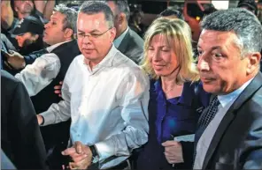  ?? BULENT KILIC / AFP ?? US pastor Andrew Brunson (center left) arrives at Adnan Menderes airport in Izmir, Turkey, on Friday after a two-year detention that shook relations between the countries.