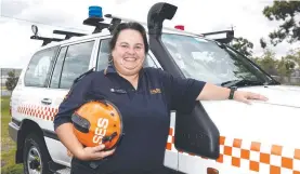  ??  ?? Leanne Woolard reflects on the 10-year flood anniversar­y at Pimpama SES headquarte­rs. Picture: Jason O'Brien