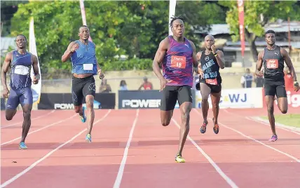  ?? IAN ALLEN PHOTO ?? Javon Francis (centre) on his way to winning the men’s 400m at the McKenley-Wint meet at Calabar last Saturday. Francis stopped the clock at 46.19 seconds.