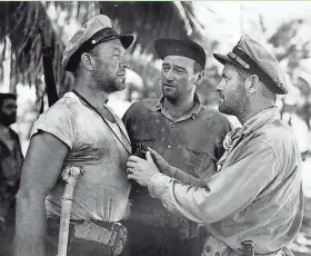  ?? MGM ?? Ward Bond, from left, John Wayne and Robert Montgomery in a scene from the 1945 World War II film “They Were Expendable.”