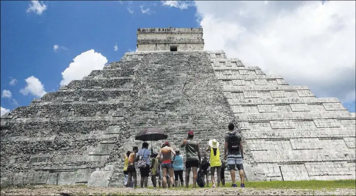  ?? Ross D. Franklin The Associated Press ?? While beach destinatio­ns remain popular for spring break, travel agents say customers are seeking cultural destinatio­ns, such as Mexico’s Chichen-Itza ruins.