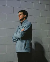  ?? BILLY SCHUERMAN/STAFF ?? Donohue stands in a tunnel before the start of a Feb. 15 game against Louisiana at Chartway Arena. He started as a student manager at UVA, where he eventually met Jeff Jones.