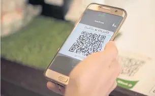  ??  ?? Consumers will soon be able to use standard QR codes to make payments with a smartphone.