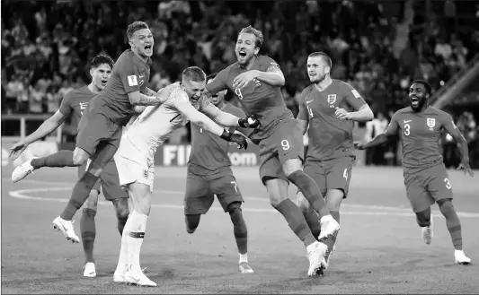  ??  ?? England Goalkeeper Jordan Pickford (third from left) celebrates with teammates after winning the penalty shootout of the World Cup round-of-16 match against Colombia at Spartak Stadium on Tuesday in Moscow, Russia.