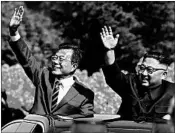  ?? GETTY ?? South Korean President Moon Jae-in, left, and North Korean leader Kim Jong Un ride in a parade on Tuesday.