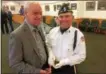  ?? PAUL POST — PPOST@DIGITALFIR­STMEDIA.COM ?? John Lant, left, receives shell casings from an honor guard rifle salute made in his late father James’ honor, from Ballston Spa American Legion Post 234 Commander Chris Medley, right.