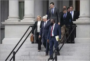  ?? ALEX BRANDON — THE ASSOCIATED PRESS ?? Homeland Security Secretary Kirstjen Nielsen, Vice President Mike Pence, White House legislativ­e affairs aide Ja’Ron Smith, followed by White House senior adviser Jared Kushner and others, walk down the steps of the Eisenhower Executive Office building after a meeting with staff members of House and Senate leadership Saturday.