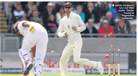  ??  ?? ■ James Anderson runs out West Indies’ Kieran
Powell at Edgbaston yesterday.