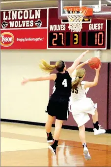  ?? MARK HUMPHREY ENTERPRISE-LEADER ?? Prairie Grove junior Emily Grant beats a hustling Huntsville’s Macy Campbell downcourt for a layup during the Lady Tigers’ 37-20 consolatio­n victory during the District 4A-1 girls basketball tournament at Lincoln Saturday.