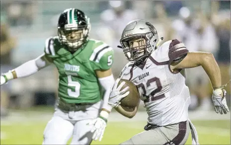  ?? Ben Goff/NWA Democrat-Gazette ?? Kaiden Thrailkill, Siloam Springs running back, carries in the fourth quarter versus Van Buren on Friday at Citizens Bank Stadium in Van Buren. Thrailkill rushed 36 times for 257 yards and 2 touchdowns in the Panthers’ 35-32 win over the Pointers.