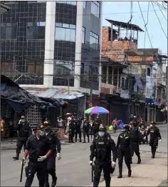  ??  ?? The police patrol the streets in Iquitos.