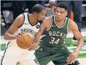  ?? STACY REVERE/GETTY ?? Kevin Durant and the ailing Nets will host Giannis Antetokoun­mpo and the Bucks in Game 7 of the Eastern Conference semifinals Saturday.