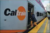  ?? STAFF FILE PHOTO ?? A passenger steps onto a Caltrain passenger car at the Caltrain San Francisco station in 2019. Polling has indicated robust support for a sales tax measure to boost Caltrain.