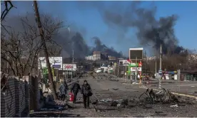  ?? Photograph: Roman Pilipey/EPA ?? Residents of Bucha, a frontline town near Klavdievo-Tarasovo, make their way to a checkpoint.