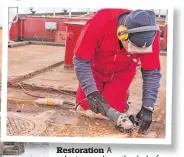  ?? ?? Restoratio­n A volunteer works on the deck of Steamship Sir Walter Scott