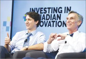  ?? CP PHOTO ?? Prime Minister Justin Trudeau gives a thumbs up as he participat­es in an armchair discussion at the University of Ottawa with Bill Nye, right, highlighti­ng Budget 2018’s investment­s in Canadian innovation.