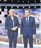  ?? ERIC FEFERBERG/REUTERS ?? Marine Le Pen y Emmanuel Macron.