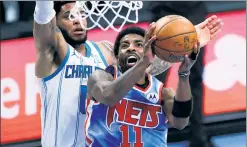  ?? AP; Getty Images ?? THIS SITS WELL: While Kyrie Irving and LaMarcus Aldridge led the Nets past the Hornets in an easy win on Thursday, Brooklyn was without Kevin Durant, James Harden and Blake Griffin.