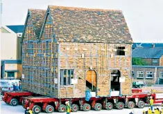  ??  ?? Easy does it: a 15th-century listed building is moved to a new site in Boston, Lincolnshi­re