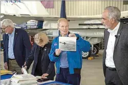  ?? JOSHUA FISHER / NASA ?? NASA Administra­tor Bill Nelson displays a picture of the X-3 as NASA Armstrong Flight Research Center Director David McBride watches during an opening ceremony for a time capsule sealed in 1996.