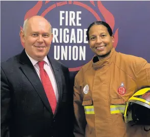  ??  ?? Albert Owen MP for Ynys Môn supports firefighte­rs at Westminste­r