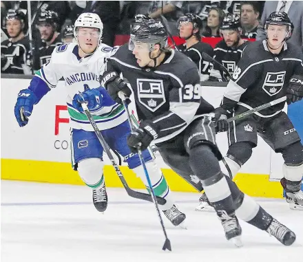  ?? — THE ASSOCIATED PRESS ?? Canucks forward Brock Boeser gives chase as Los Angeles Kings forward Adrian Kempe pushes the pace Saturday in Los Angeles. Boeser scored the overtime winner in that game.