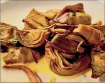  ?? ?? Aside from meats, Iron & Grass also has menu items like artichokes with black garlic-lemon aioli.