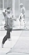  ??  ?? Afghanista­n bowler Rashid Khan (C) bowls in the nets during the team’s practice session at the M. Chinnaswam­y Stadium in Bangalore.