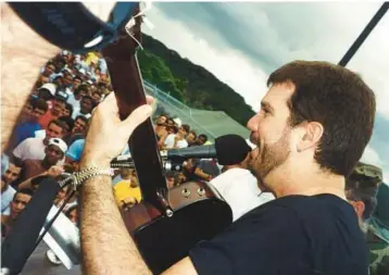  ?? ZARABANDA PRODUCTION­S PHOTOS ?? Music icon Willy Chirino performs in 1994 at an outdoor concert in Panama for Cuban detainees. Chirino’s five decades in music are at the center of an exhibition at HistoryMia­mi Museum through September.